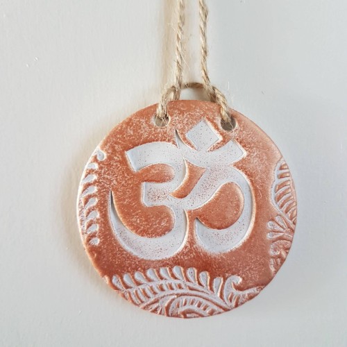 Metallic coloured Om clay wall decoration