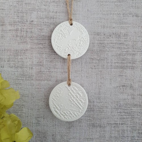 White clay wall hanging with butterfly and dragonfly design