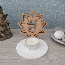 Jain Om shadow wood and clay tealight holder