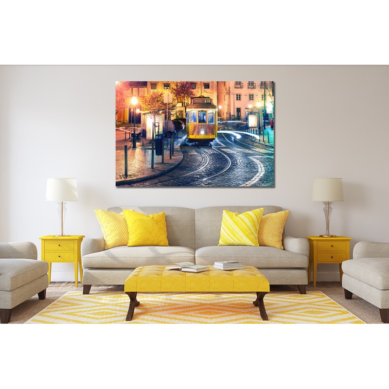 Famous vintage yellow 28 tram of of Alfama, in the oldest district of the Old Town at night, Lisbon, Portugal Printed Canvas