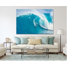 Surfer rides a giant wave at the legendary big wave surf break Printed Canvas