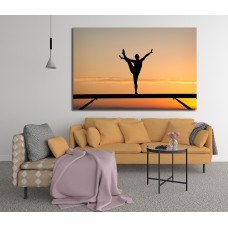 Silhouette of female gymnast on balance beam in sunset Printed Canvas
